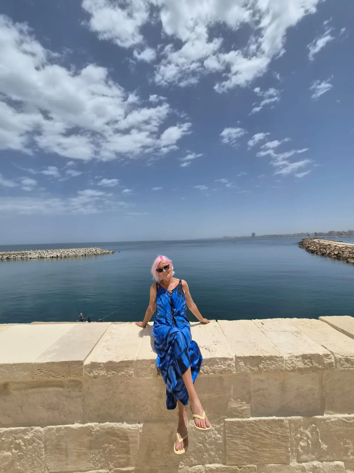 Visitor overlooking the Mediterranean Sea in Alexandria