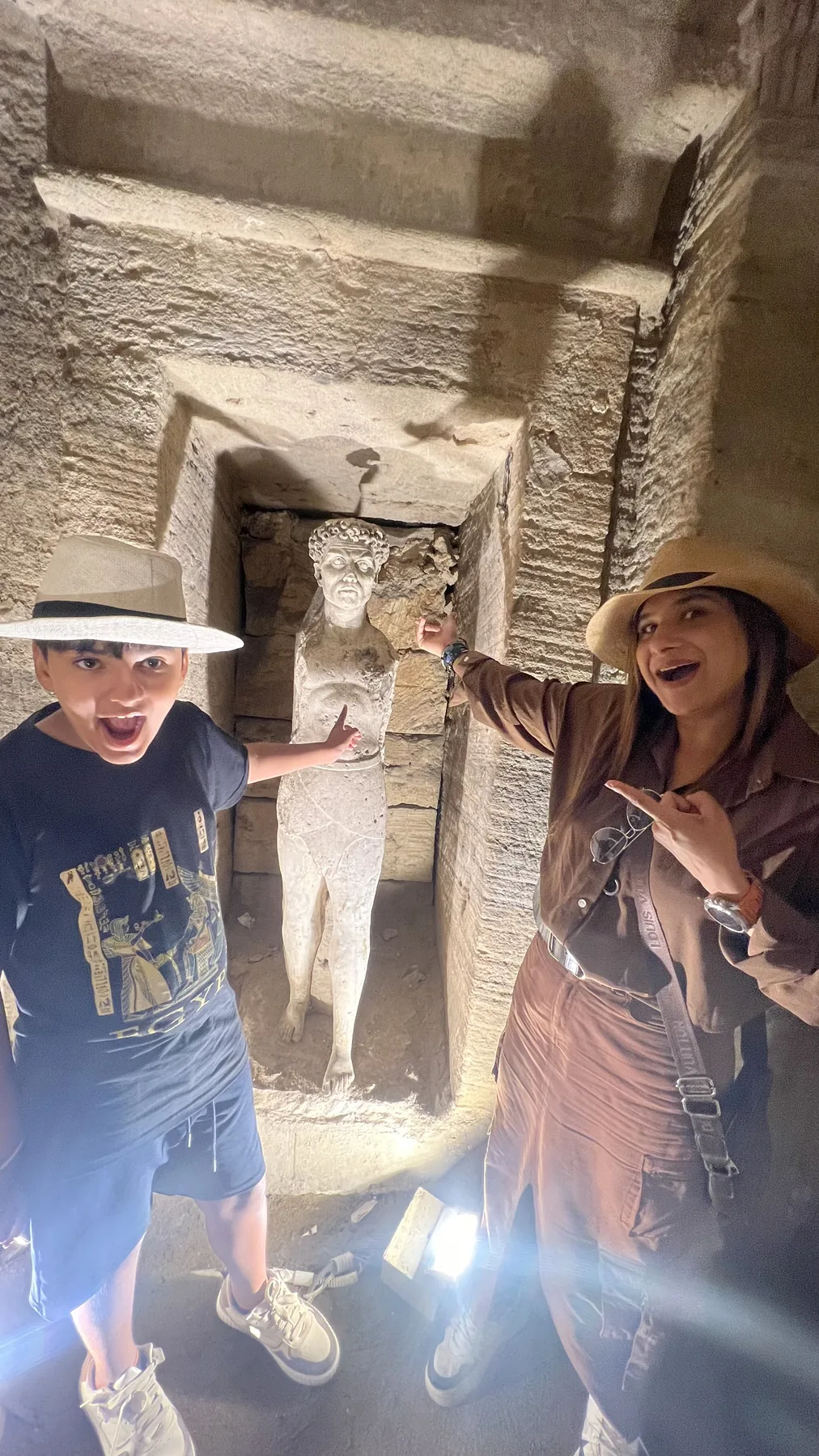 Travelers visiting the ancient catacombs in Alexandria