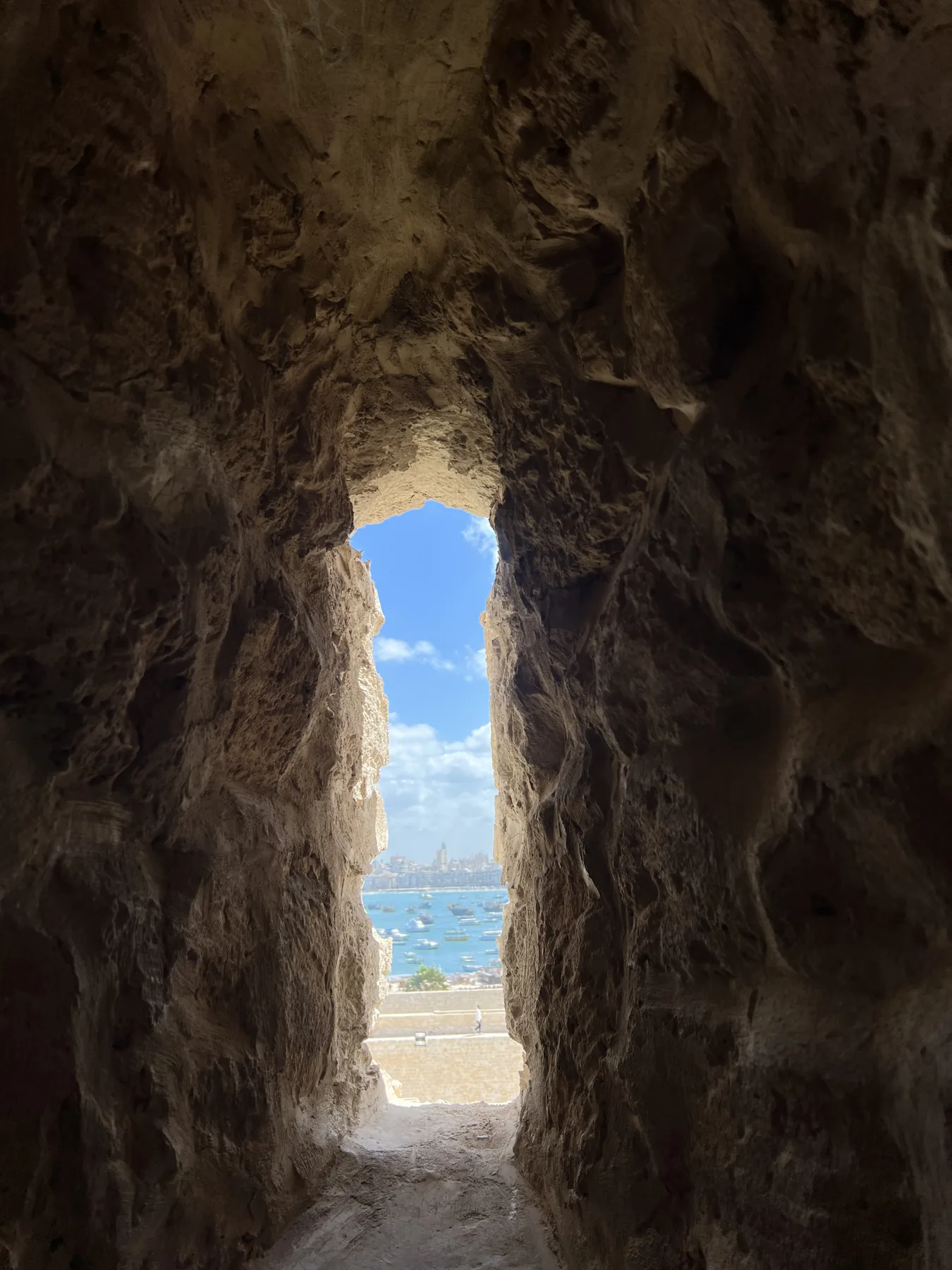 View of the Mediterranean Sea through a stone opening at the Citadel of Qaitbay