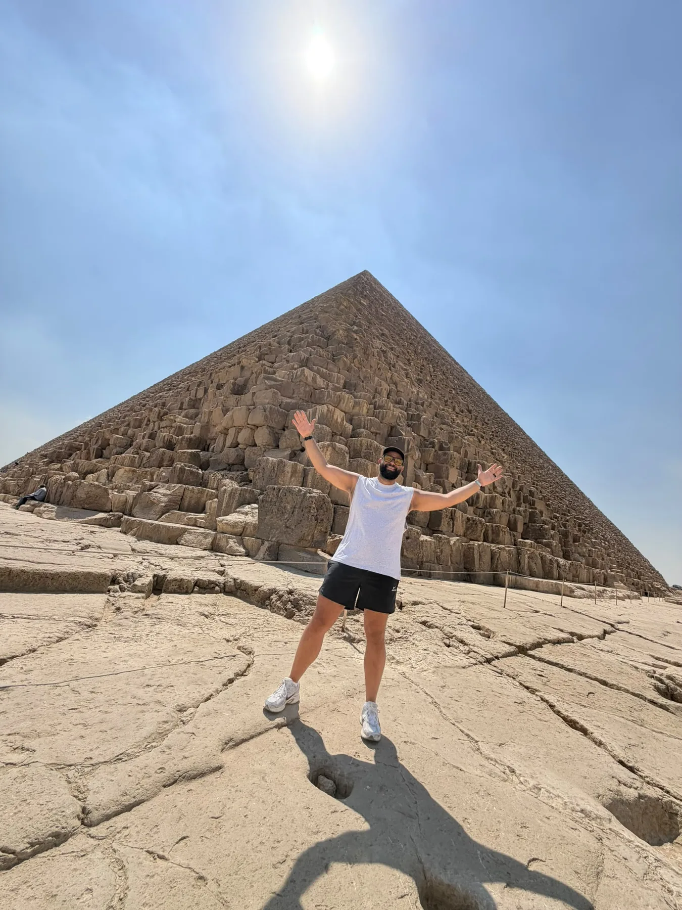 Traveler standing beside a pyramid at Giza